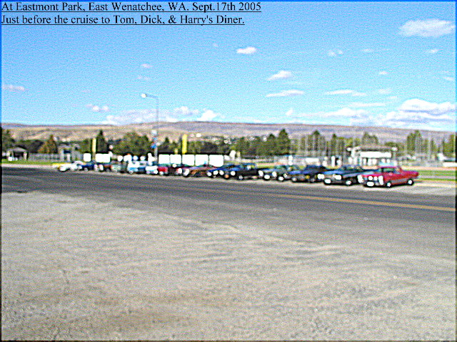 Row of classic cars parked at Eastmont Park car cruise, East Wenatchee WA 2005