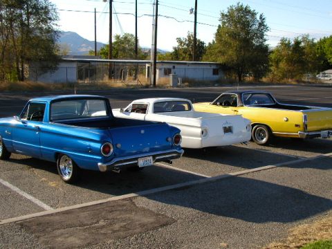 1967 Ford Ranchero - Three Ford Rancheros are parked in a lot on a sunny day.