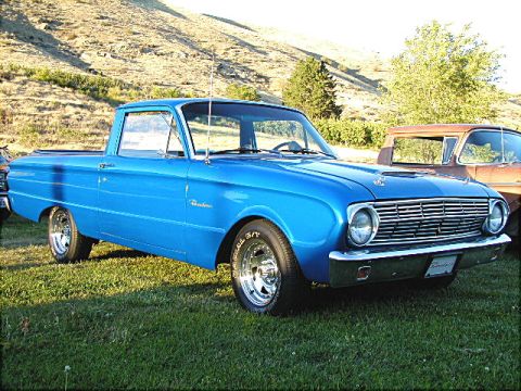 1967 Ford Ranchero - Blue Ford Ranchero pickup truck parked outdoors with a hill in the background.