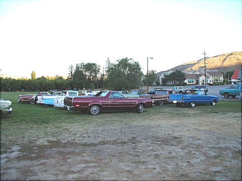 1967 Ford Ranchero - Several classic cars, including a maroon 1972 Ford Ranchero, are parked on a grassy field.