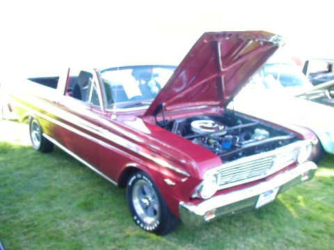 1967 Ford Ranchero - Red 1967 Ford Ranchero on display with its hood open.