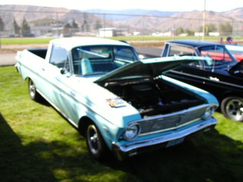 1967 Ford Ranchero - This 1967 Ford Ranchero is displayed with its hood open, revealing the engine bay.
