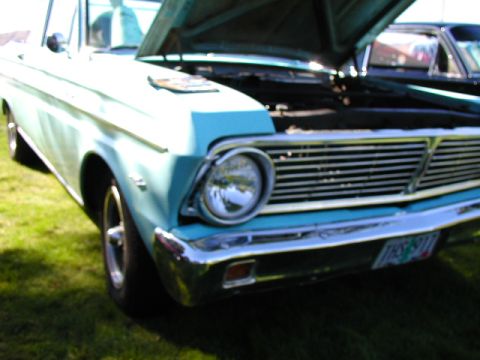 1967 Ford Ranchero - A light blue 1966 Ford Falcon Ranchero is shown with its hood up, parked on a grassy area.