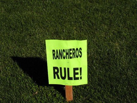 1967 Ford Ranchero - A sign proclaiming 'Rancheros Rule!' is planted in a grassy area.