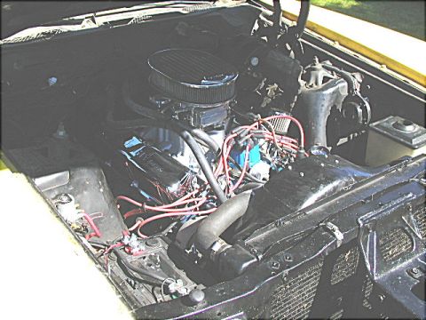 1967 Ford Ranchero - The engine bay of a vehicle, an aftermarket air cleaner and visible wiring.