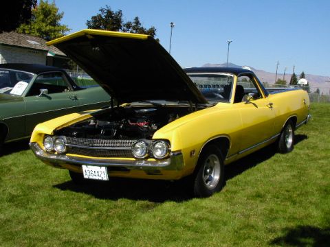1967 Ford Ranchero - Yellow 1968 Ford Ranchero with hood open, parked next to a green vehicle on a sunny day.