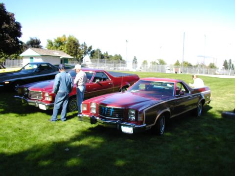 1967 Ford Ranchero - Several Ford Rancheros are parked on the grass at an outdoor event.