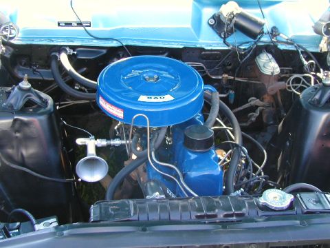 1967 Ford Ranchero - Close-up of the engine bay in a 1967 Ford Ranchero, highlighting the blue air cleaner assembly with a '200' designation.