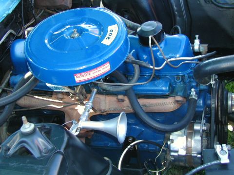 1967 Ford Ranchero - The engine features a blue painted block and valve cover, with an Autolite spark plug sticker on the air cleaner housing.