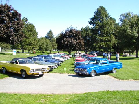 1967 Ford Ranchero - A lineup of classic Ford Rancheros and other vehicles gathered for an event on a grassy field.