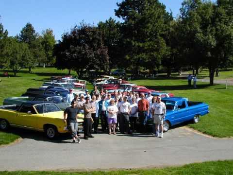 1967 Ford Ranchero - A gathering of Ford Ranchero enthusiasts pose with their vehicles on a sunny day.