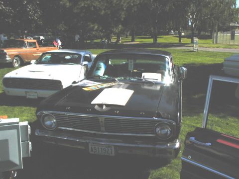 1967 Ford Ranchero - Front view of a black 1967 Ford Ranchero at an outdoor car event.