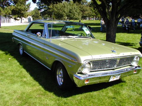1967 Ford Ranchero - Light green 1966 Ford Falcon coupe with chrome trim and a distinctive grille.