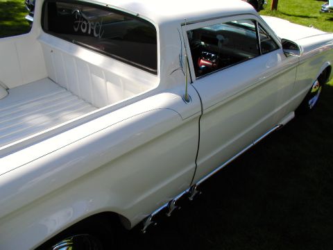 1967 Ford Ranchero - White 1967 Ford Ranchero pickup truck with a clean bed and visible interior details.