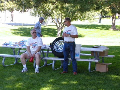 1967 Ford Ranchero - Gathering at a picnic table with a spare tire on display.