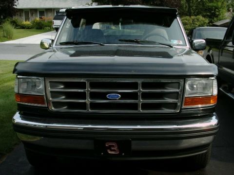 1992 Ford Bronco - Front view of a 1992 Ford Bronco with a chrome bumper and grille.