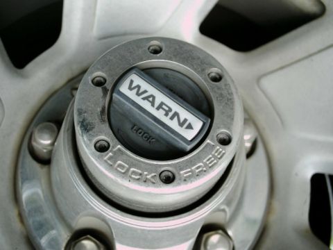 1992 Ford Bronco - This is a close-up view of a Warn manual locking hub, showing the 'LOCK' setting.