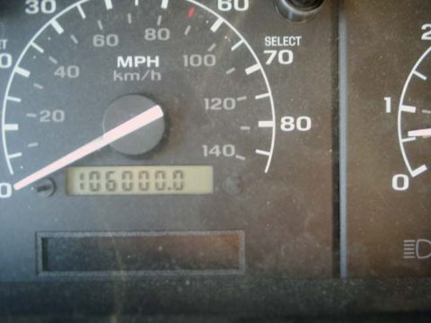 1992 Ford Bronco - The odometer displays 106,000 miles on the dashboard of the dashboard gauges.