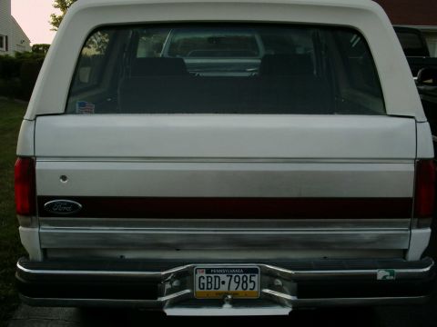 1988 Ford Bronco - The rear of a white Ford Bronco with a chrome bumper and a Pennsylvania license plate.