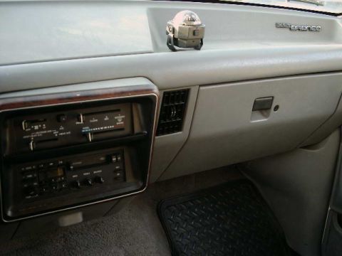 1988 Ford Bronco - Interior view of a 1988 Ford Bronco dashboard, showing the radio and climate controls.