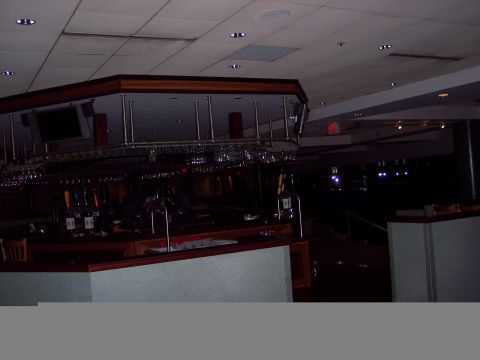 2001 Ford Crown Victoria - Interior view of a bar area, a mirrored back wall displaying rows of hanging glassware.