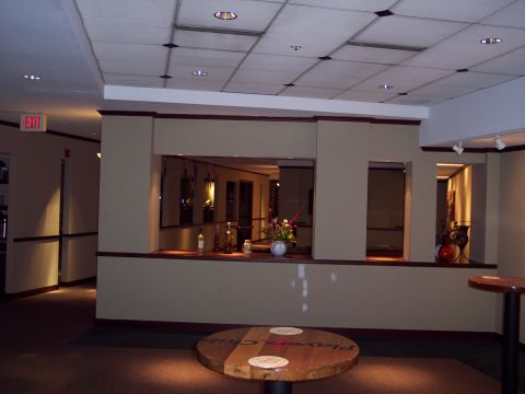 2001 Ford Crown Victoria - An interior view of a building shows a counter with decorative items and a round table in the foreground.