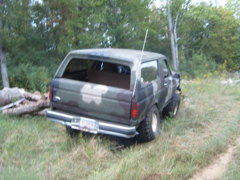 1988 Ford Bronco - This 1988 Ford Bronco is seen from the rear, sporting a camouflage paint job and a white antenna.
