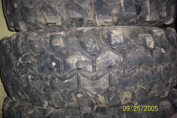 stacked off-road tires with aggressive tread pattern