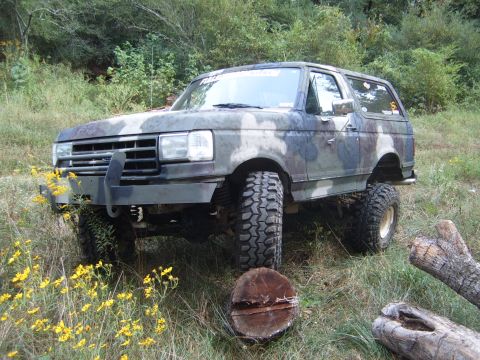 1988 Ford Bronco - This 1988 Ford Bronco is ready for off-road adventures with its camouflage paint and lifted suspension.
