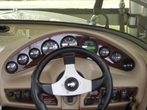 2000 Mastercraft Prostar 190 - Interior view of a boat's dashboard, showing gauges and controls.