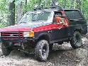 1977 Ford F-150 - This off-road SUV features a two-tone paint scheme and is equipped for terrain.