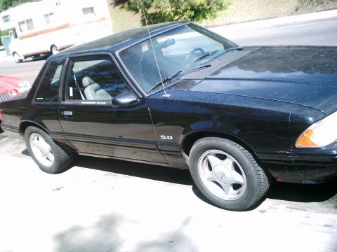 1986 Ford Bronco - This black coupe features a prominent 5.0 badge, indicating a specific engine option.