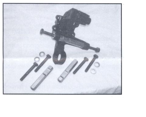 1997 Ford Taurus - A black suspension component is shown with several bolts and washers, suggesting it is a replacement part.