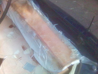 1994 Ford Probe - This image shows a fiberglass repair being worked on, with the Supermotors.net logo in the corner.