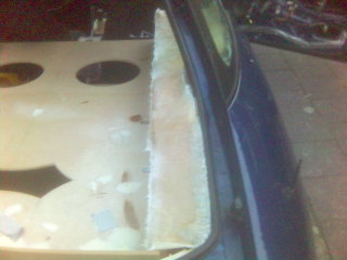 1994 Ford Probe - Close-up of a car door with a partially installed panel, showing the interior construction.