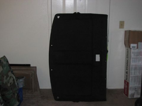 1991 Ford Bronco - Black car headliner panel, possibly for a Ford Bronco, shown indoors.