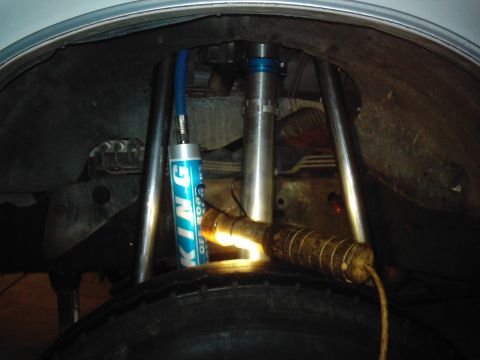 1978 Ford Bronco - Custom suspension components, including a King Off-Road shock, are visible within the wheel well of a vehicle.