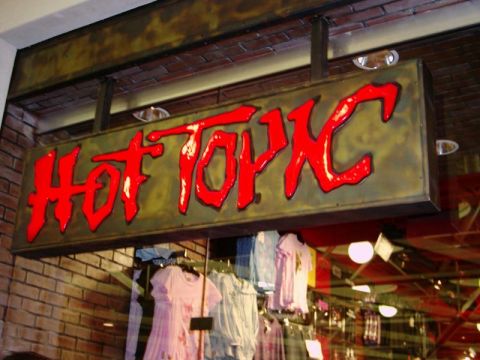 1988 Ford Bronco - Signage for the Hot Topic store is visible above clothing racks displaying t-shirts.