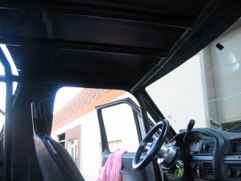 1992 Ford Bronco - Interior view of a vehicle, highlighting the rollcage structure and dashboard details.