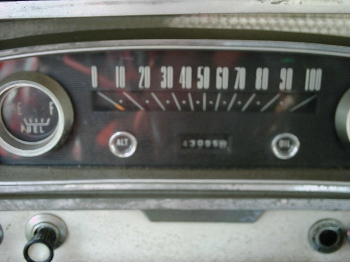 Vintage instrument cluster with horizontal speedometer to 100, fuel gauge, ALT and OIL lights, odometer 43995