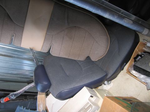 1991 Ford LTD Crown Victoria - Interior car seats are shown in a storage area, with various boxes and items in the background.