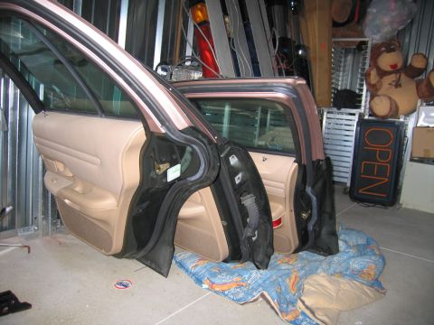 1991 Ford LTD Crown Victoria - Interior view of a 1991 Ford Crown Victoria LTD with both front doors removed.
