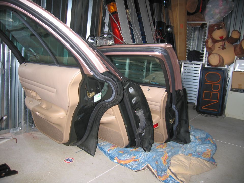 Two doors removed from a 1991 Ford Crown Victoria LTD, showing interior panels and frame