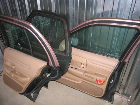 1991 Ford LTD Crown Victoria - Two car doors, likely from the same vehicle, are shown with their interiors visible.