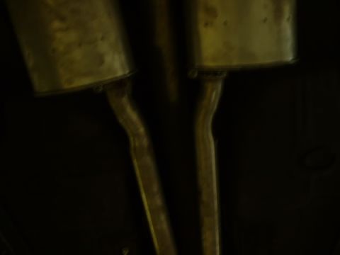 1978 Ford Mustang II - Underside view of dual exhaust mufflers, likely from a classic vehicle.