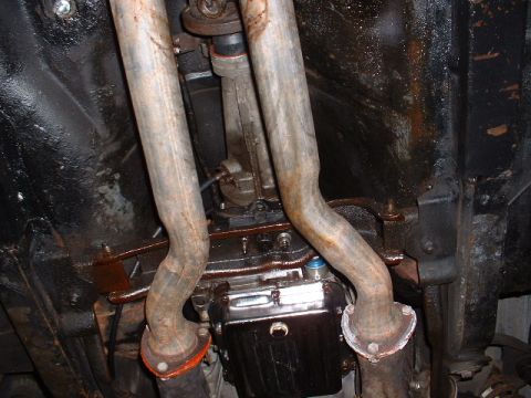 1978 Ford Mustang II - Underside view of dual exhaust pipes and transmission assembly.