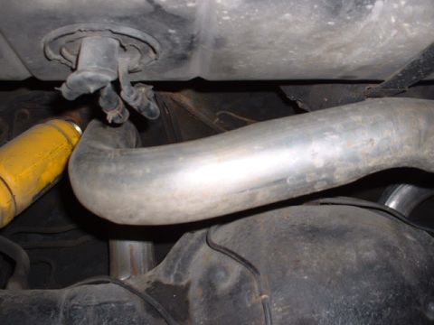 1978 Ford Mustang II - Underside view of a vehicle's exhaust system and suspension components.