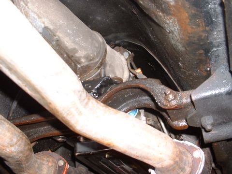 1978 Ford Mustang II - Underside view of exhaust pipes and suspension parts, with a watermark for Supermotors.net.
