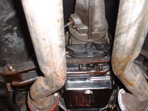 1978 Ford Mustang II - Underside view of exhaust pipes and transmission pan.