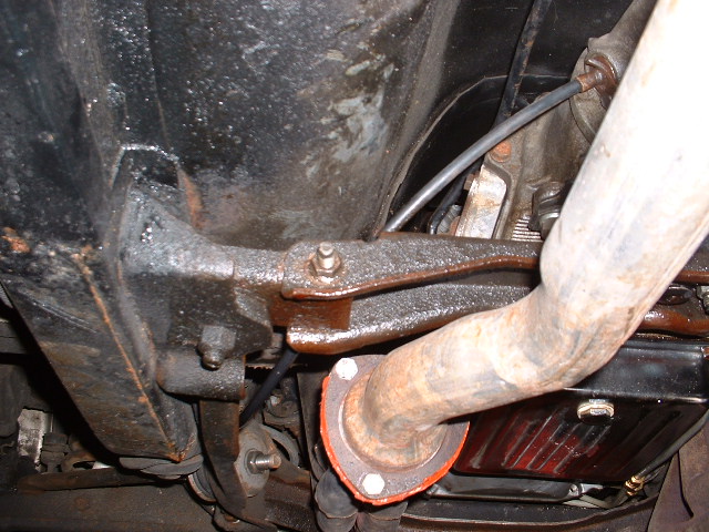 Underside view of a vehicle's exhaust pipe and suspension components